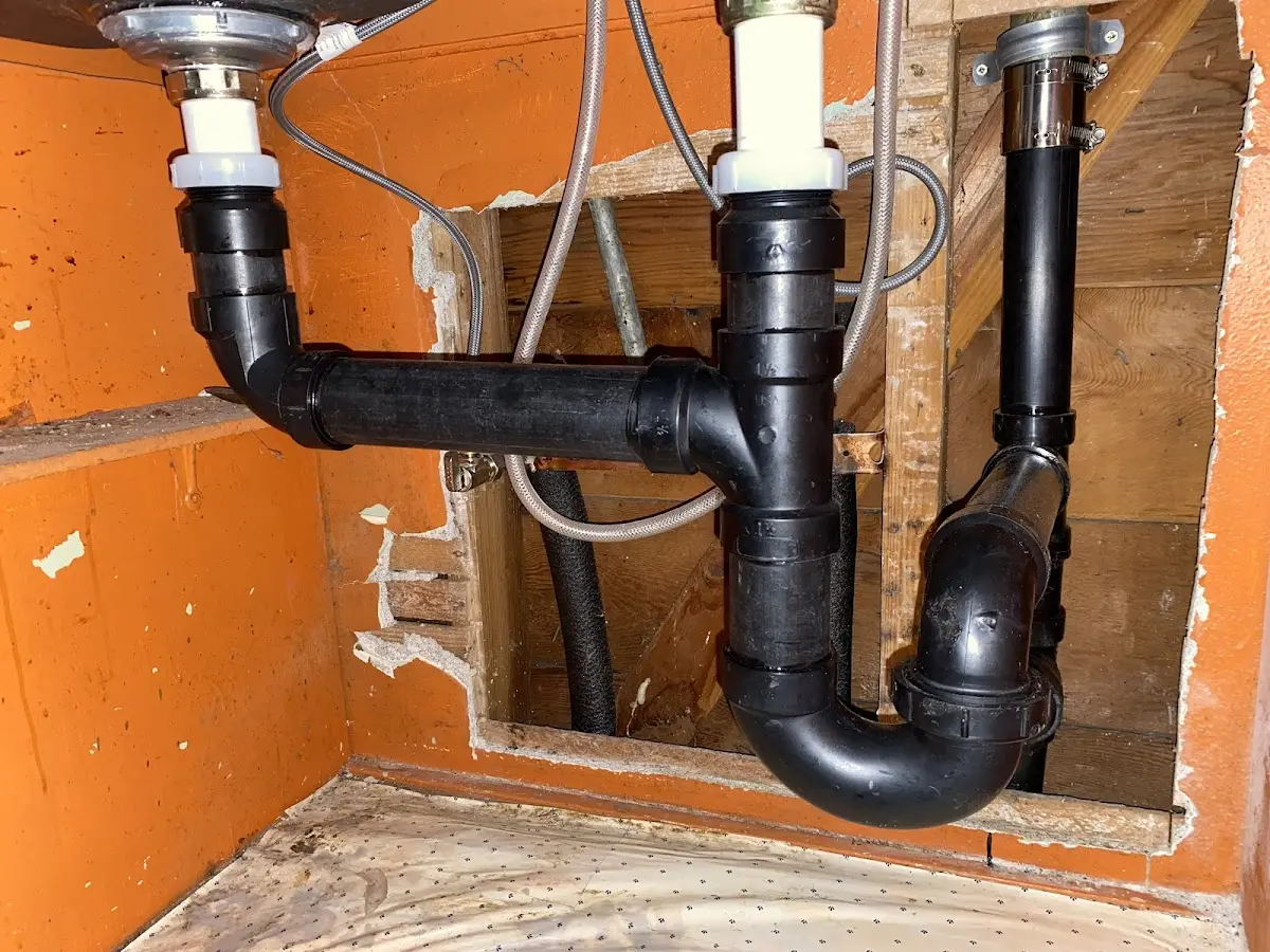 Professional Garbage Disposal Repair equipment and tools on the job in Framingham